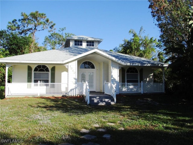 view of front facade with a front lawn and a porch