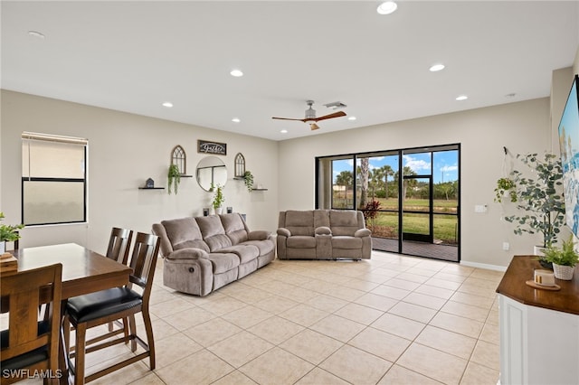 living room with ceiling fan and light tile patterned floors