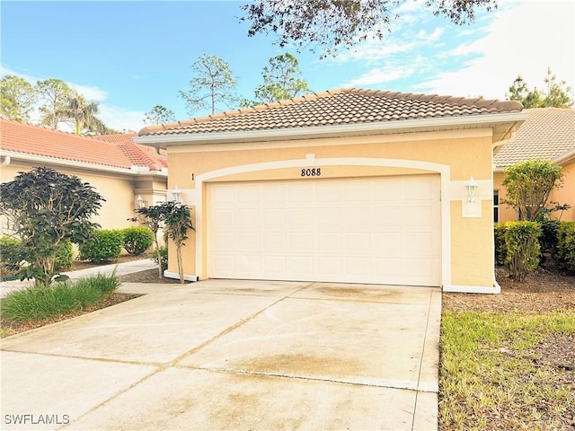 mediterranean / spanish-style home with a garage