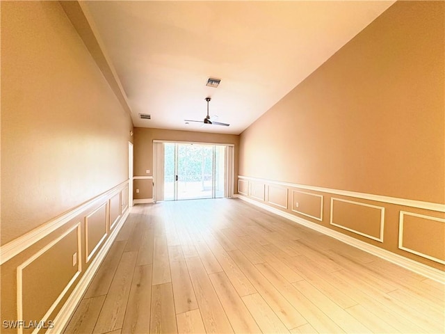 unfurnished room featuring ceiling fan and light hardwood / wood-style flooring