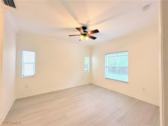 unfurnished room with light hardwood / wood-style floors, ceiling fan, and a healthy amount of sunlight