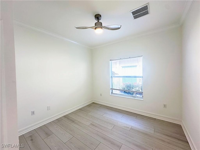 unfurnished room with ceiling fan, light wood-type flooring, and crown molding