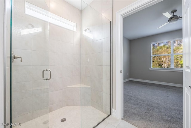 bathroom with ceiling fan and a shower with shower door