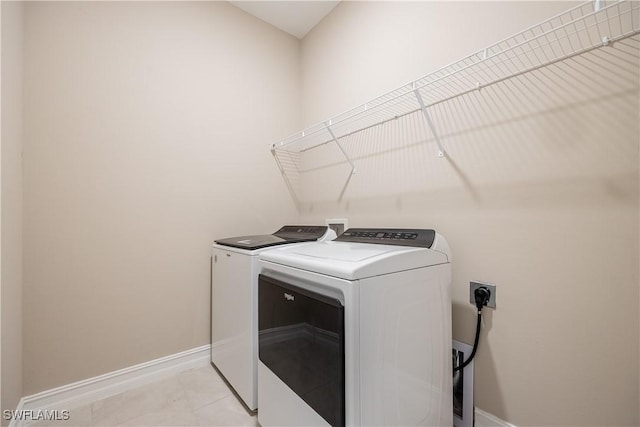 laundry room with independent washer and dryer