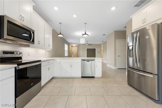 kitchen with pendant lighting, white cabinetry, stainless steel appliances, kitchen peninsula, and ceiling fan