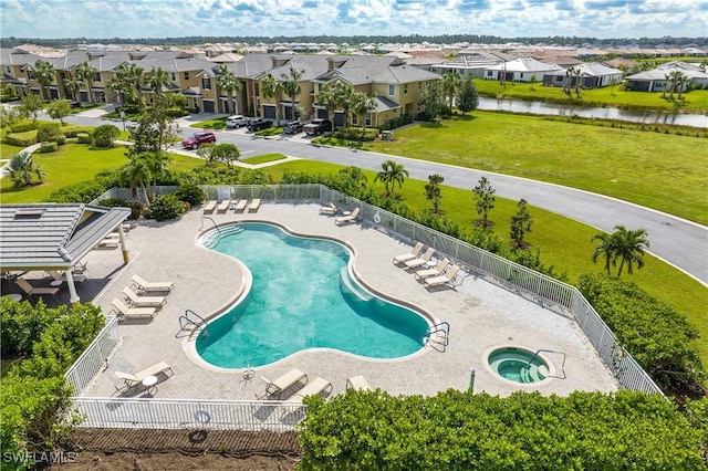 view of pool with a water view