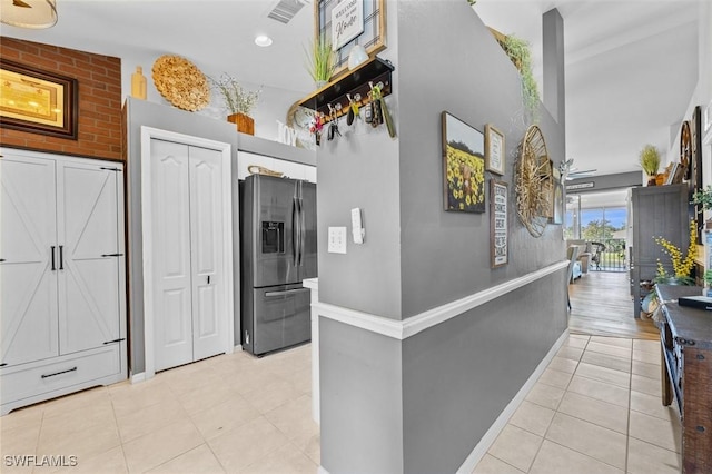 hall with light tile patterned flooring