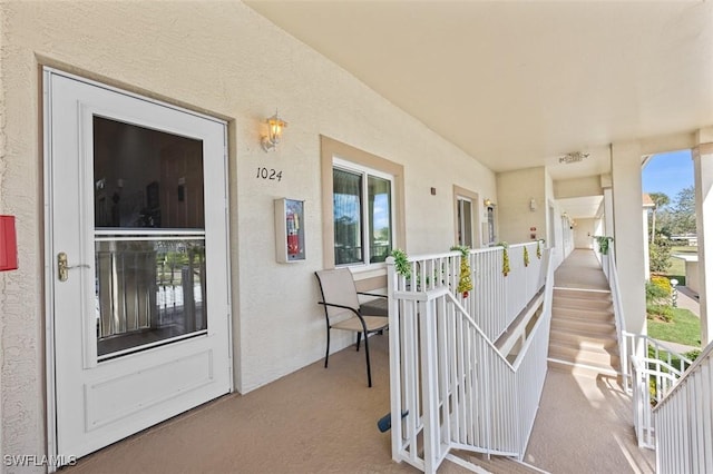 entrance to property featuring a porch