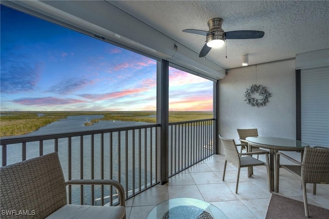 balcony featuring ceiling fan