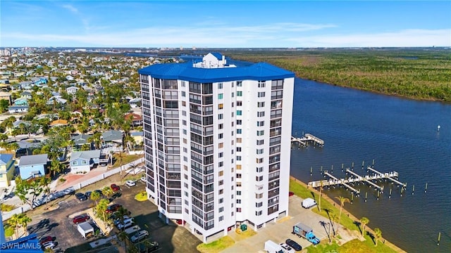 birds eye view of property with a water view