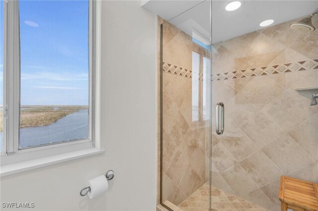 bathroom featuring a stall shower and recessed lighting