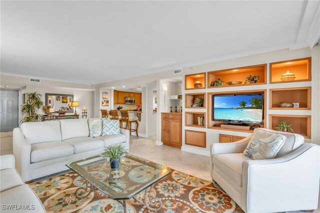 living room featuring ornamental molding, visible vents, built in features, and light tile patterned floors