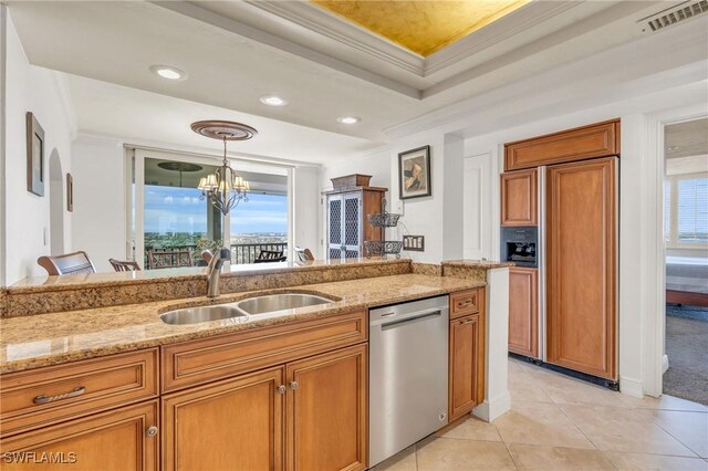 kitchen featuring light stone counters, hanging light fixtures, stainless steel dishwasher, ornamental molding, and a sink