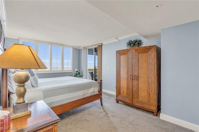 bedroom with baseboards, ornamental molding, and light colored carpet