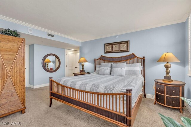 bedroom featuring light carpet, visible vents, and ornamental molding