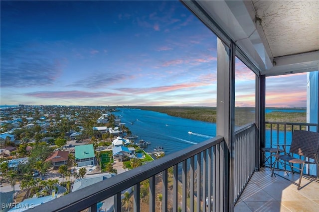 balcony featuring a water view