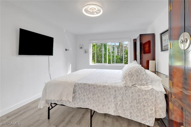 bedroom with light hardwood / wood-style flooring