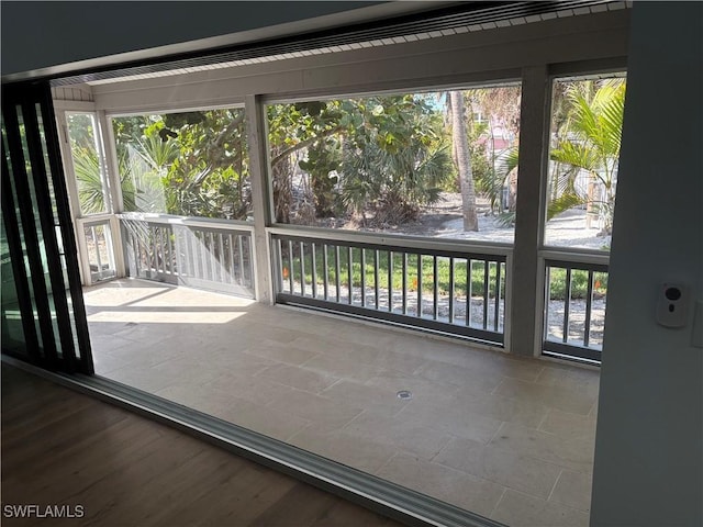 unfurnished sunroom featuring a wealth of natural light