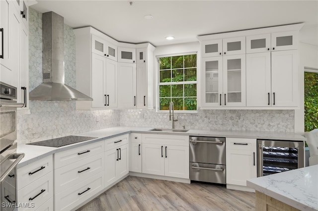 kitchen featuring white cabinetry, sink, wall chimney exhaust hood, wine cooler, and black electric cooktop