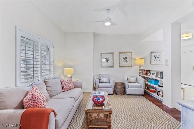 living room with hardwood / wood-style floors and ceiling fan