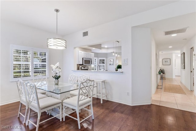 dining area featuring hardwood / wood-style floors