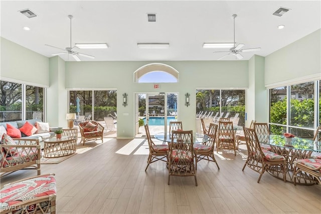 sunroom featuring ceiling fan and a healthy amount of sunlight