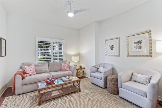 living room featuring ceiling fan and light hardwood / wood-style floors