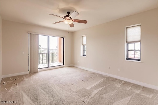 unfurnished room with light carpet and ceiling fan