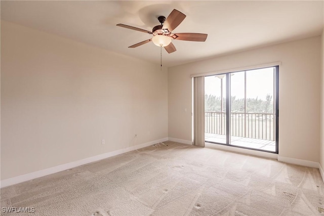 unfurnished room with ceiling fan and light colored carpet