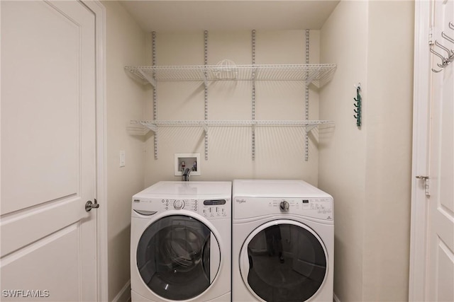 washroom featuring washer and clothes dryer