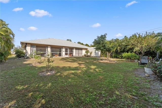 view of yard featuring a sunroom