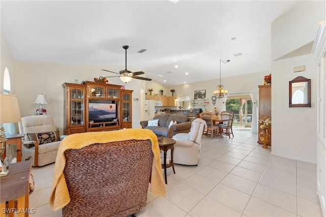 tiled living room with ceiling fan with notable chandelier and vaulted ceiling