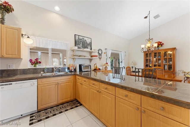 kitchen featuring dishwasher, sink, a notable chandelier, vaulted ceiling, and light tile patterned floors