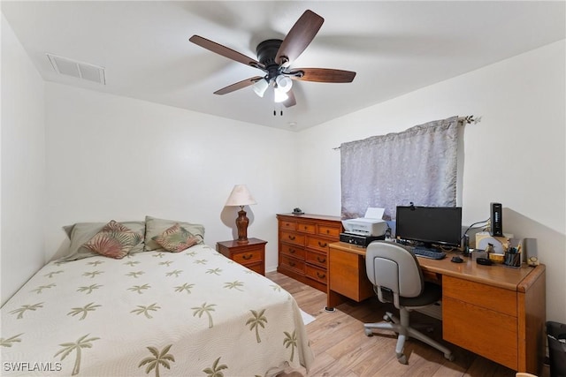 bedroom with light hardwood / wood-style flooring and ceiling fan