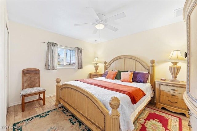 bedroom with hardwood / wood-style floors and ceiling fan