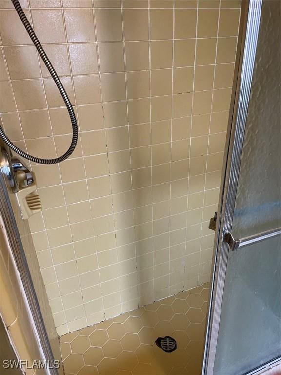 bathroom with tiled shower