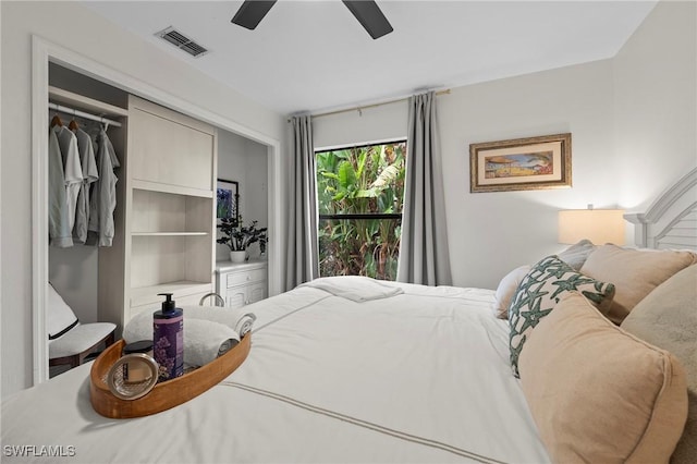 bedroom with ceiling fan and a closet