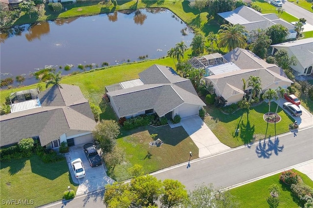 bird's eye view with a water view