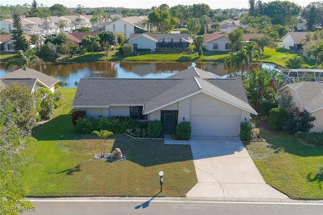 birds eye view of property featuring a water view