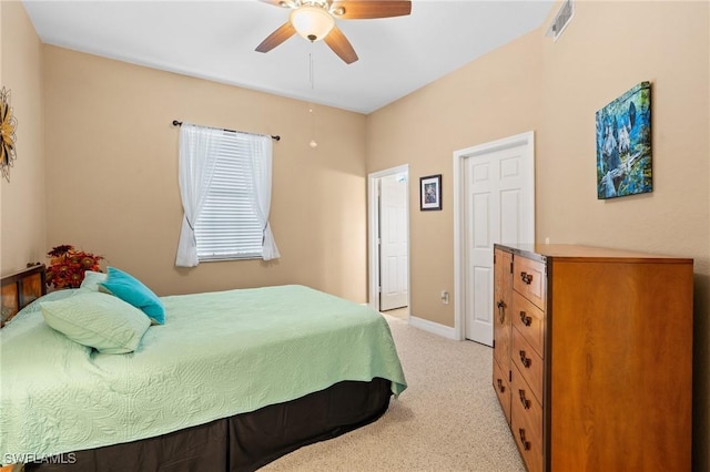 bedroom with light carpet and ceiling fan