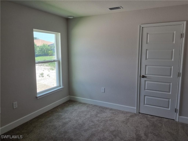 125 NW 9th Ter, Cape Coral, FL 33993 - carpeted spare room featuring baseboards