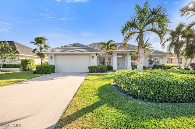 view of front of house featuring a garage and a front yard