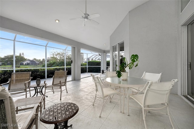 sunroom featuring ceiling fan and lofted ceiling