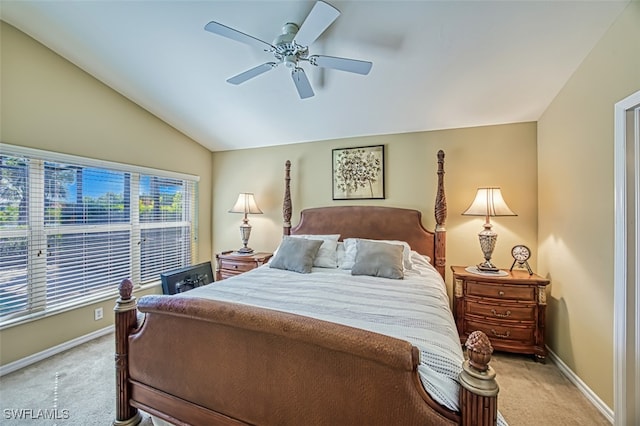 bedroom featuring ceiling fan, light colored carpet, and lofted ceiling