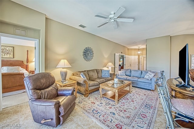 tiled living room with ceiling fan