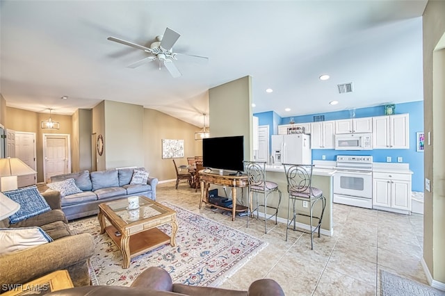 tiled living room with ceiling fan