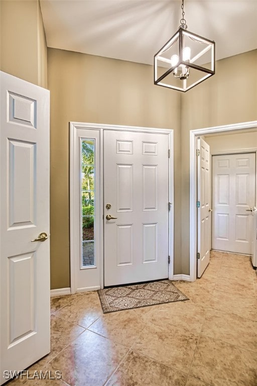 foyer with an inviting chandelier