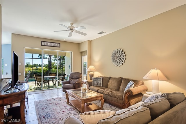 living room featuring ceiling fan and light tile patterned flooring