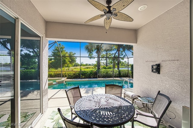 exterior space with ceiling fan and a swimming pool