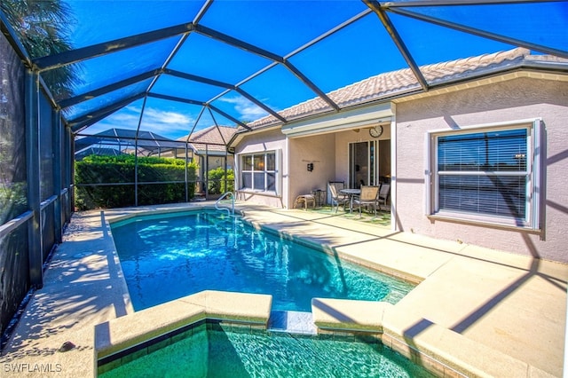 view of pool with a lanai and a patio